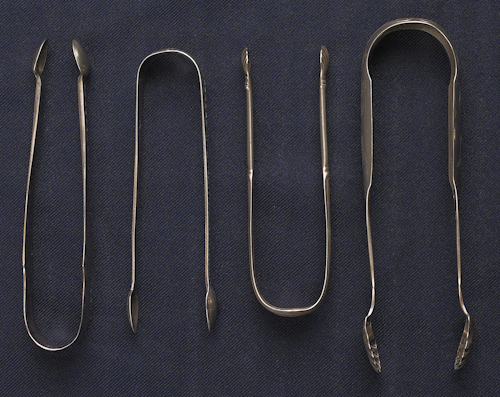 Collection of silver tongs to