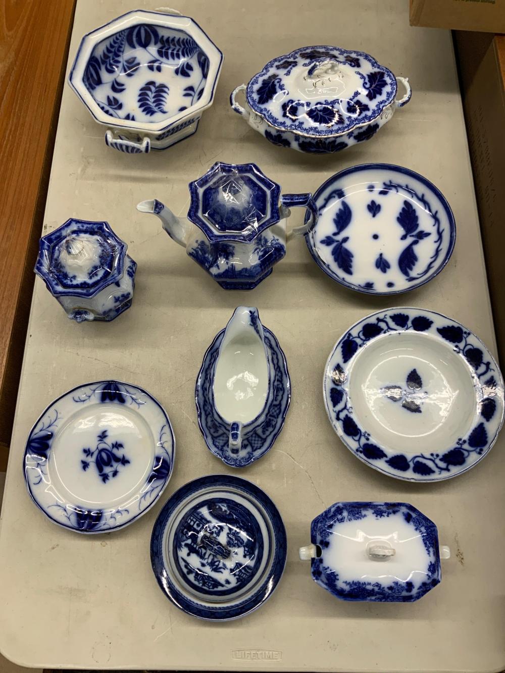 COLLECTION OF TEN FLOW BLUE TABLE