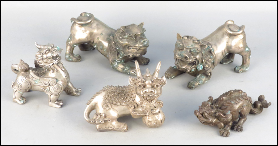 COLLECTION OF THREE METAL FOO DOGS.