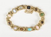 COLORED GEMSTONE AND FOURTEEN
