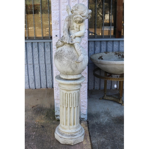 Composite stone garden putti figure