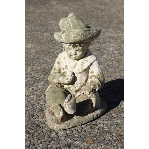 Composite stone garden statue of