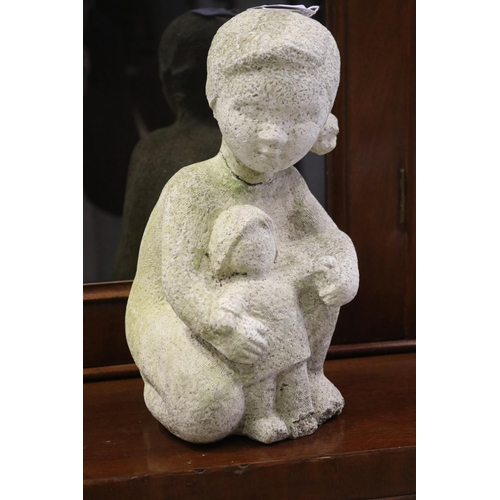 Composite stone garden statue of
