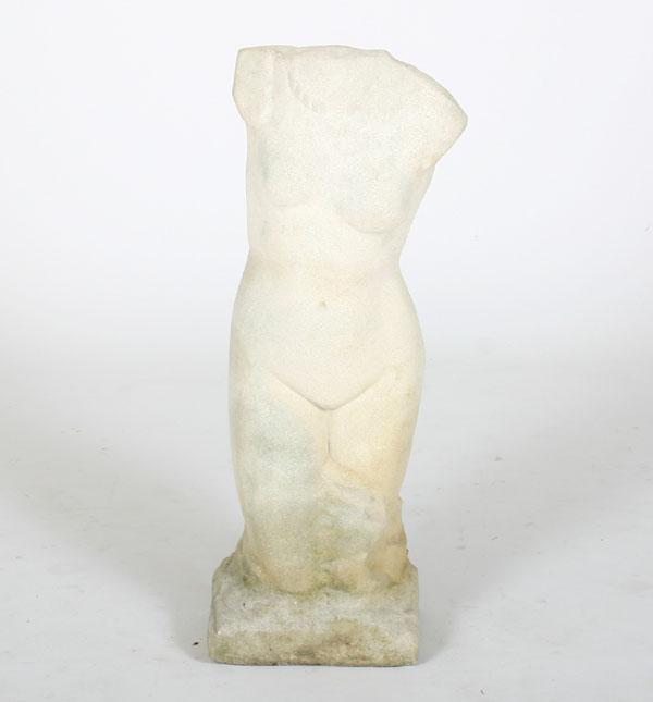 Concrete statue of a female nude