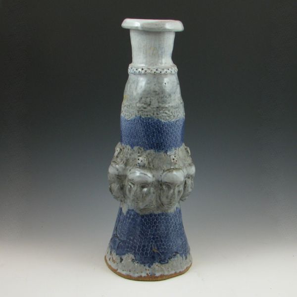 Contemporary vase with faces in