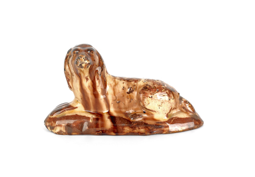 Continental redware recumbent dog