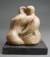 COUPLE EMBRACING CARVED STONE
