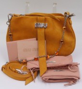 COUTURE. MIU MIU BANDOLIERA SU