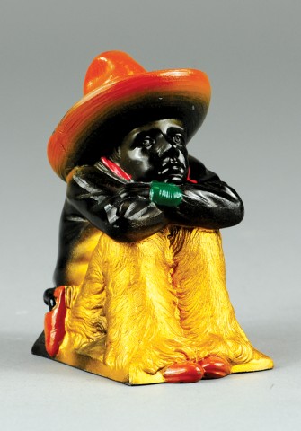 COWBOY SEATED IN RELAXED POSE