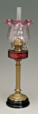Cranberry glass oil lamp, paneled