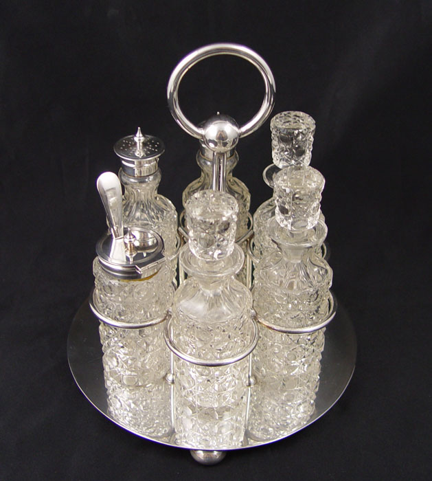 CRUET STAND WITH CUT GLASS BOTTLES: