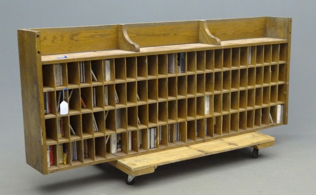 Cubby unit with various cd's.79'' W