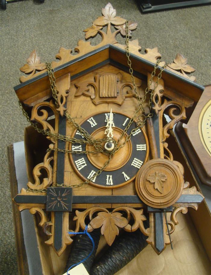 Cuckoo clock with weights and