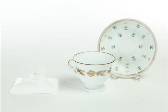 CUP AND SAUCER AND PAPERWEIGHT. 