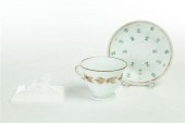 CUP AND SAUCER AND PAPERWEIGHT