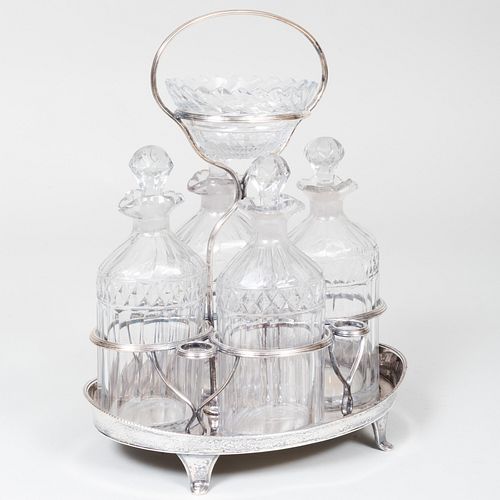 CUT GLASS CRUET SET IN A SILVER