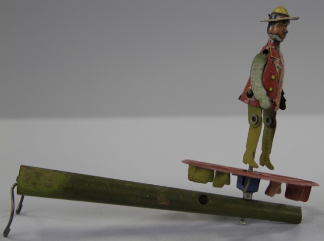 DANCING MAN WHISTLE PENNY TOY