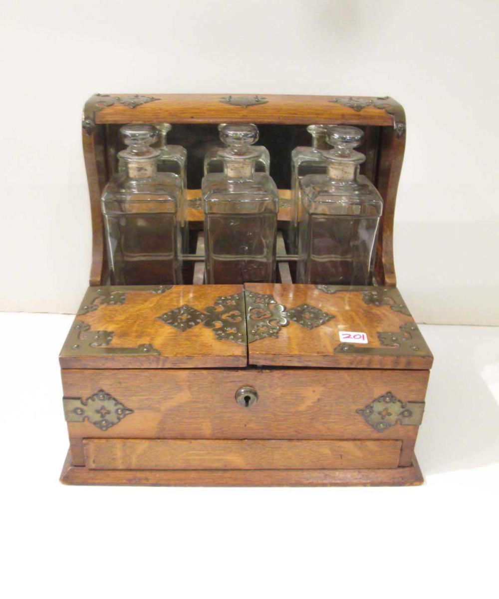 DECANTER SET, OAK AND BRASS CASE