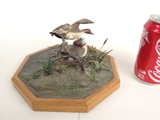 Decoy group sculpture marked