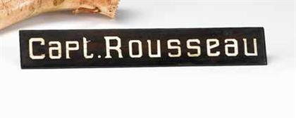 Desk sign, "Captain Rousseau"   