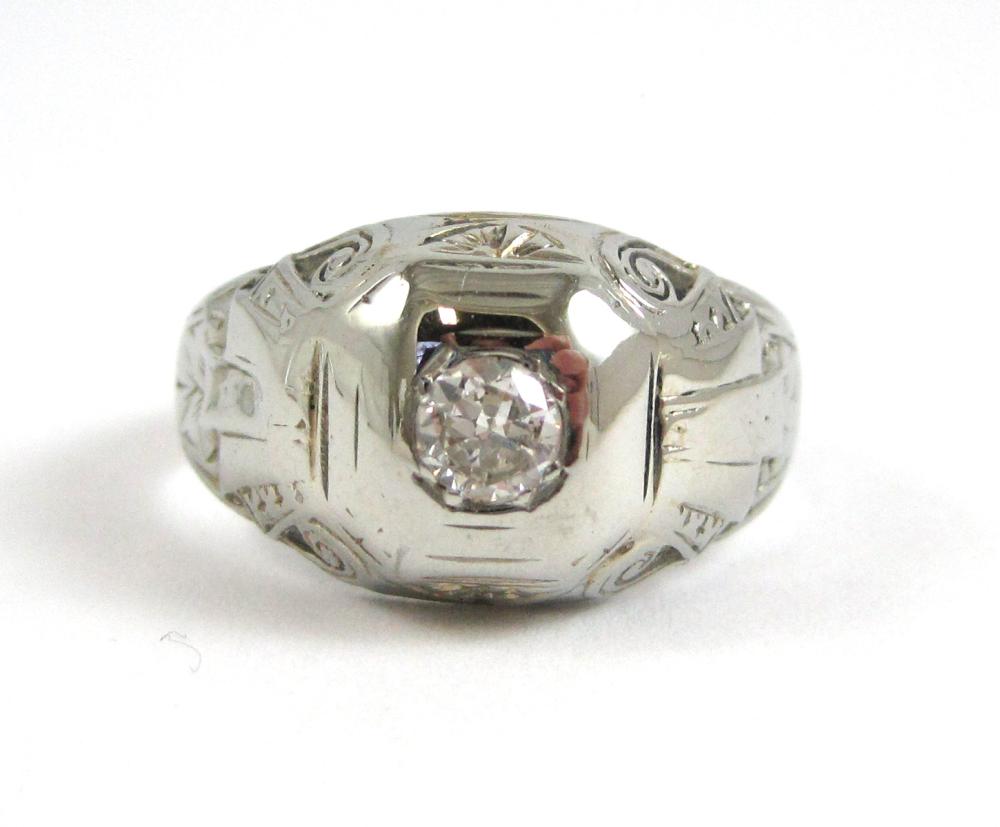 DIAMOND AND EIGHTEEN KARAT GOLD