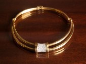 DIAMOND AND EIGHTEEN KARAT GOL