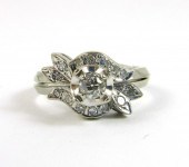 DIAMOND AND FOURTEEN KARAT FLO