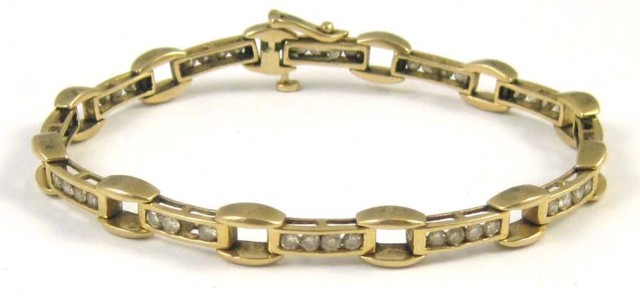 DIAMOND AND FOURTEEN KARAT GOLD