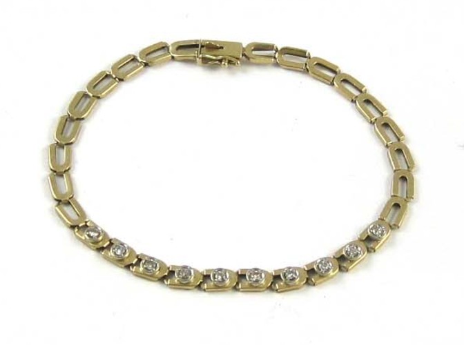 DIAMOND AND FOURTEEN KARAT GOLD