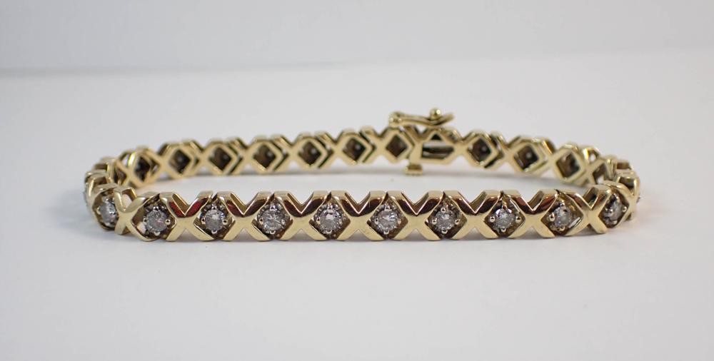 DIAMOND AND FOURTEEN KARAT GOLD