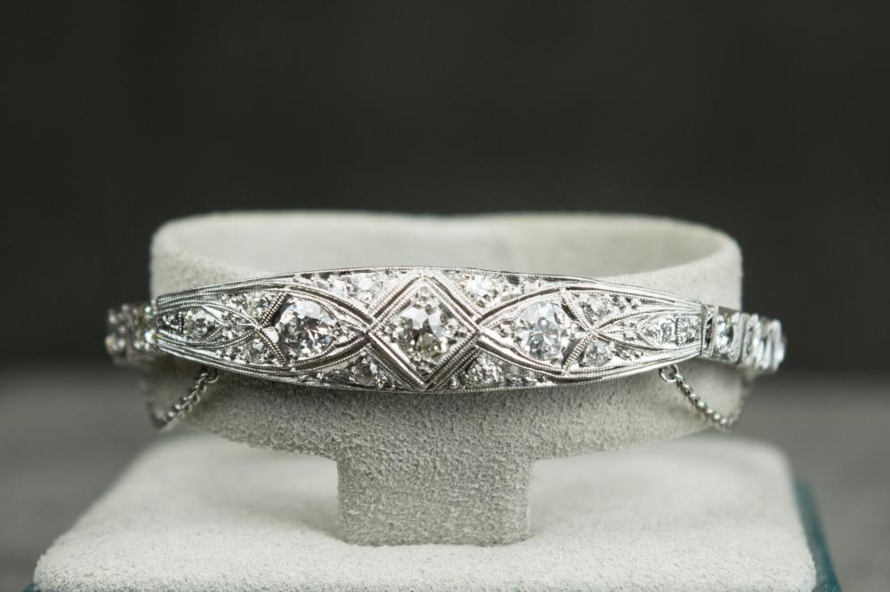 DIAMOND AND FOURTEEN KARAT WHITE