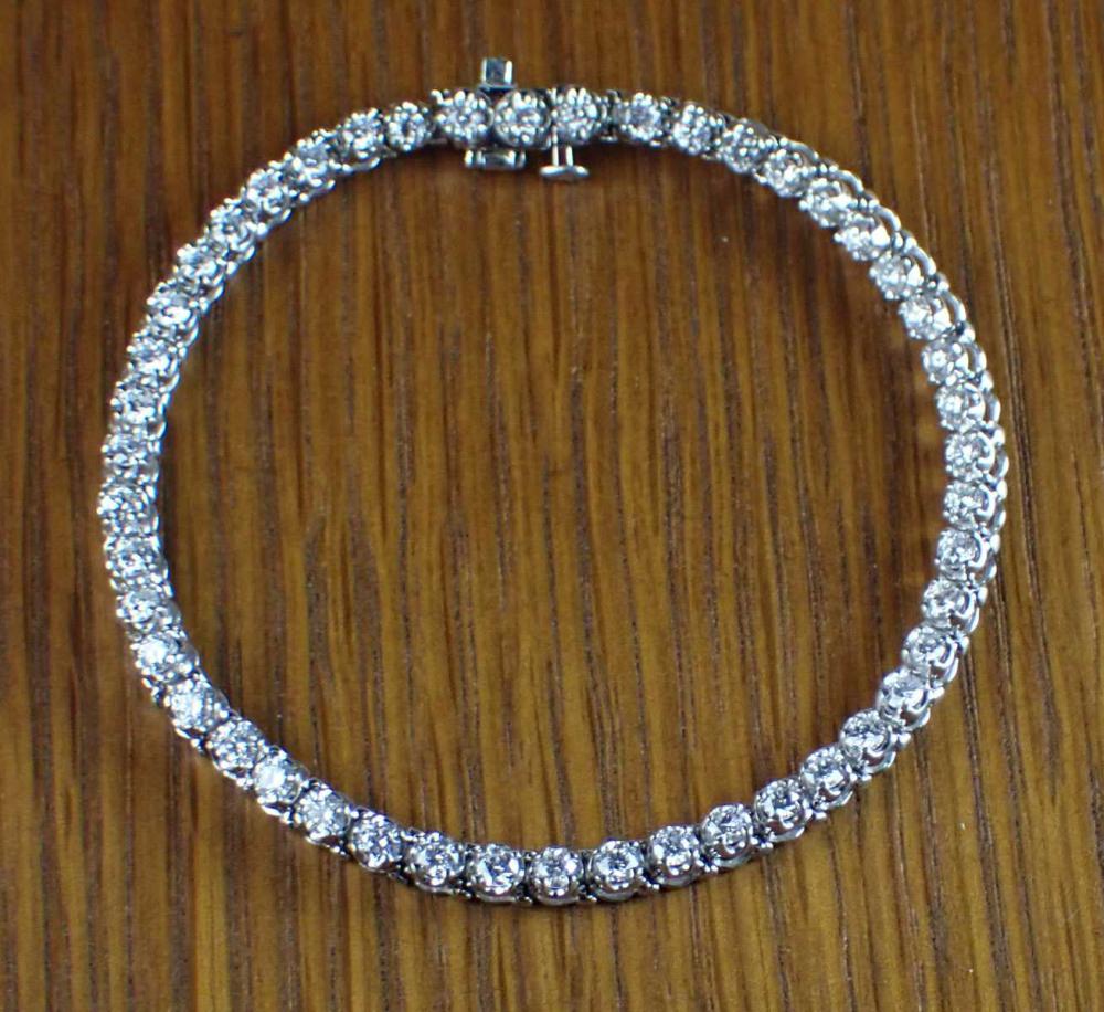 DIAMOND AND FOURTEEN KARAT WHITE