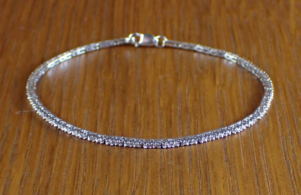 DIAMOND AND FOURTEEN KARAT WHITE