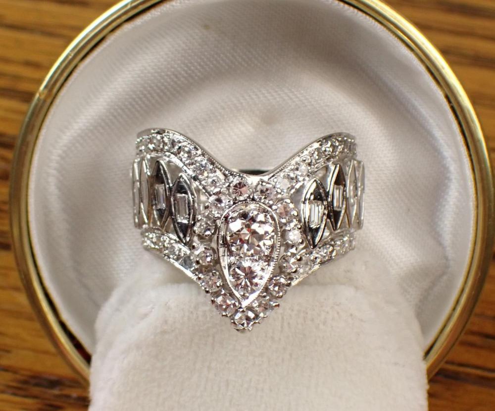DIAMOND AND FOURTEEN KARAT WHITE