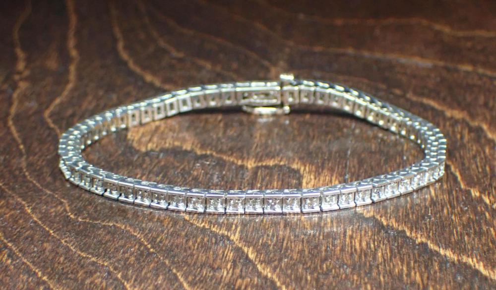 DIAMOND AND FOURTEEN KARAT WHITE