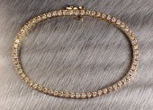 DIAMOND AND GOLD TENNIS BRACEL