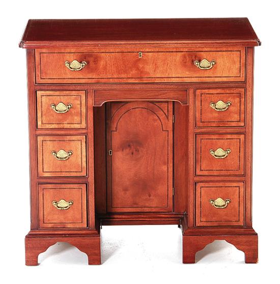 Diminutive mahogany kneehole desk