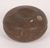 Discoidal with unusual groove;