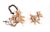DOGS' TEETH PENDANTSTwo decora