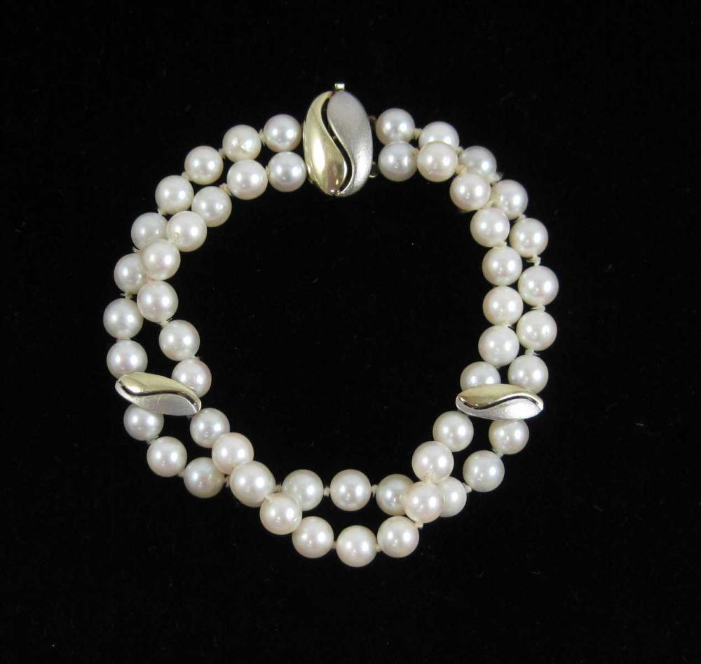 DOUBLE STRAND PEARL AND FOURTEEN