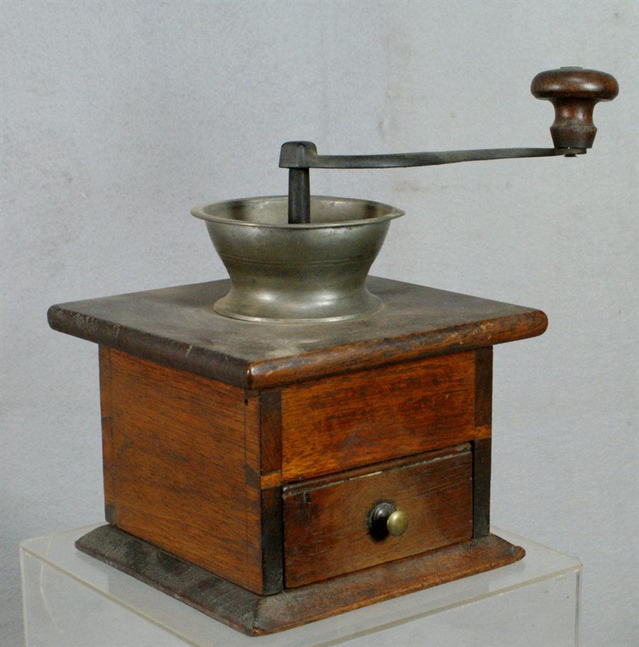 Dovetailed walnut, pewter, and cast