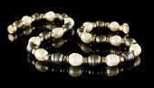 Dramatic Single Strand of Blac