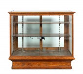 E. 20TH C. OAK AND GLASS STORE