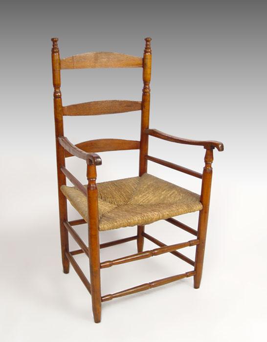 EARLY 19TH C LADDER BACK ARM CHAIR: