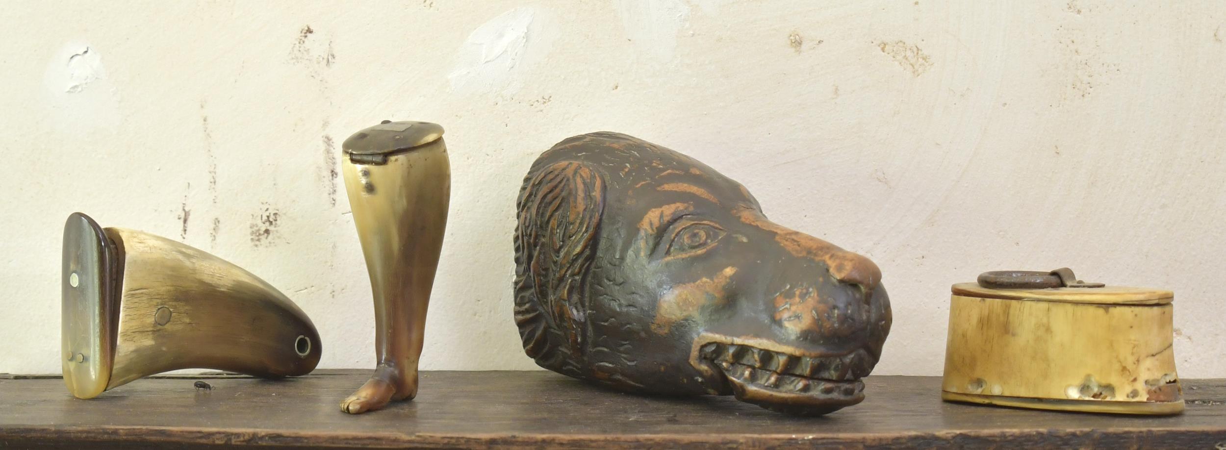 EARLY CARVED SNUFF MULLS. A group