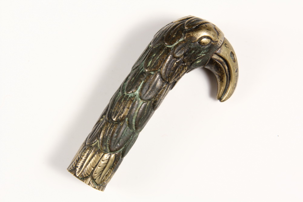 EARLY CAST BRONZE GRIP IN THE