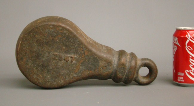 Early cast iron weight. 12'' Ht.