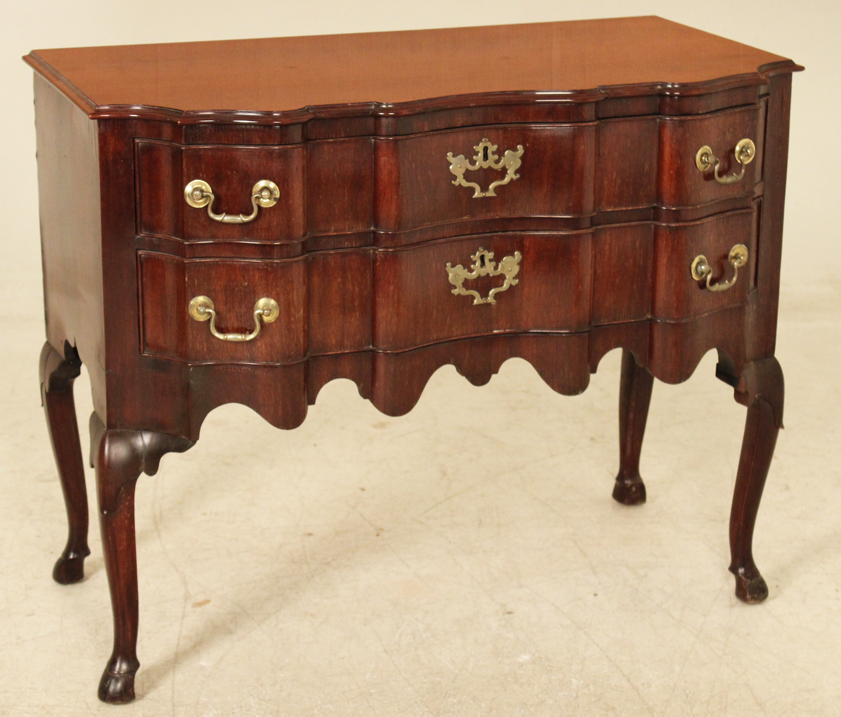 EARLY DUTCH MAHOGANY SHAPED FRONT