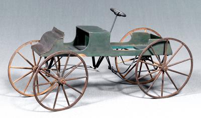 Early green-painted pedal car,