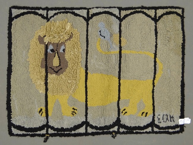 Early lion in cage hooked rug. 28''